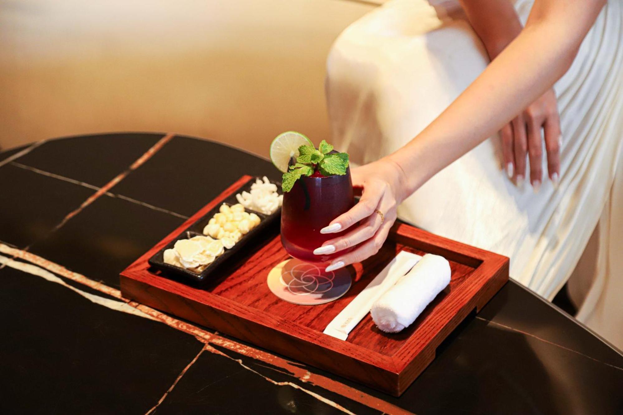 Vias Hotel Vung Tau - Transportation Included Exterior photo A woman holding a drink